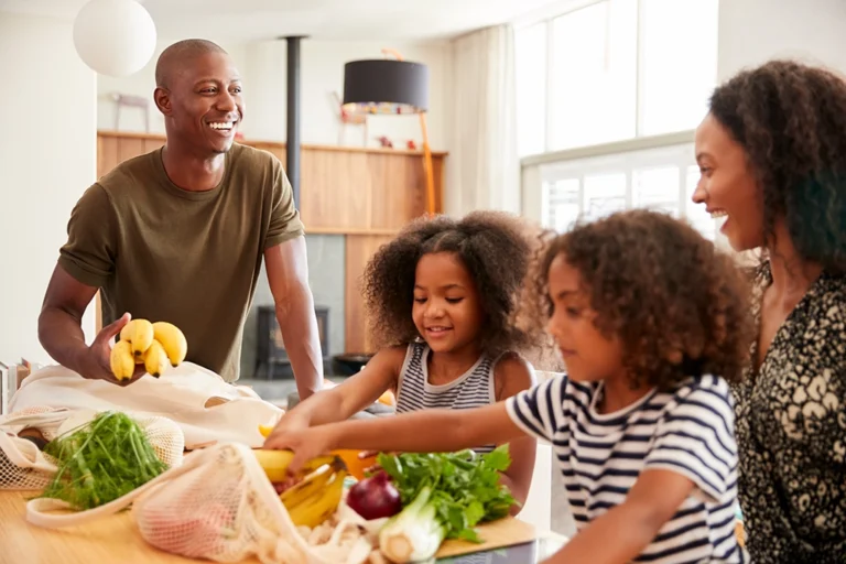 Family Unpacking Groceries After Trip To Store Gut Health
