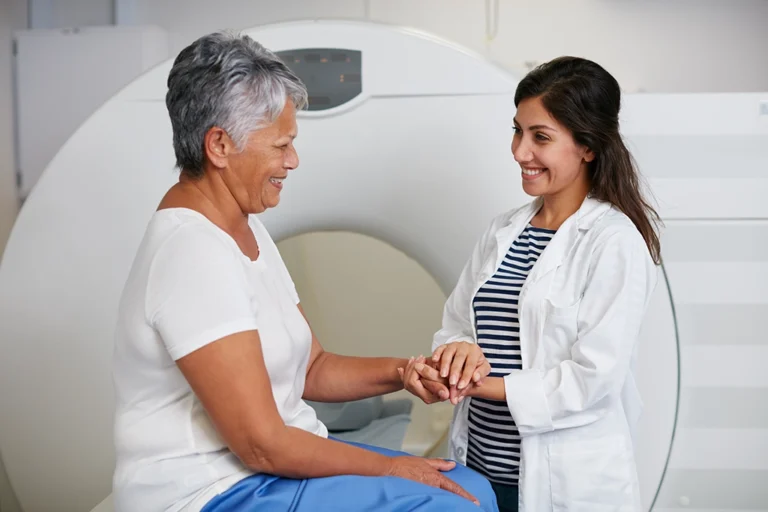 CT Technologist Speaking With Patient Before CT Scan