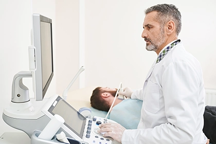 Technologist-Performing-Thyroid-Ultrasound-On-Patient