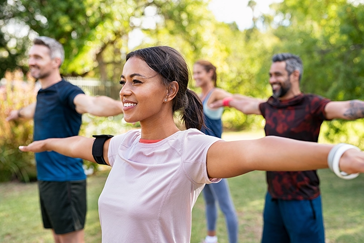 Active-Woman-Doing-Yoga-In-Park-With-Confidence-In-Her-Breast-Health