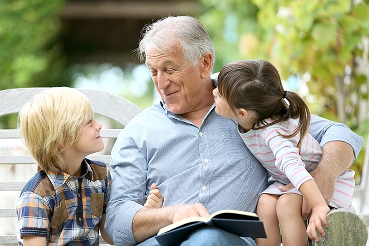 Grandfather-Reading-To-Grandchildren.webp